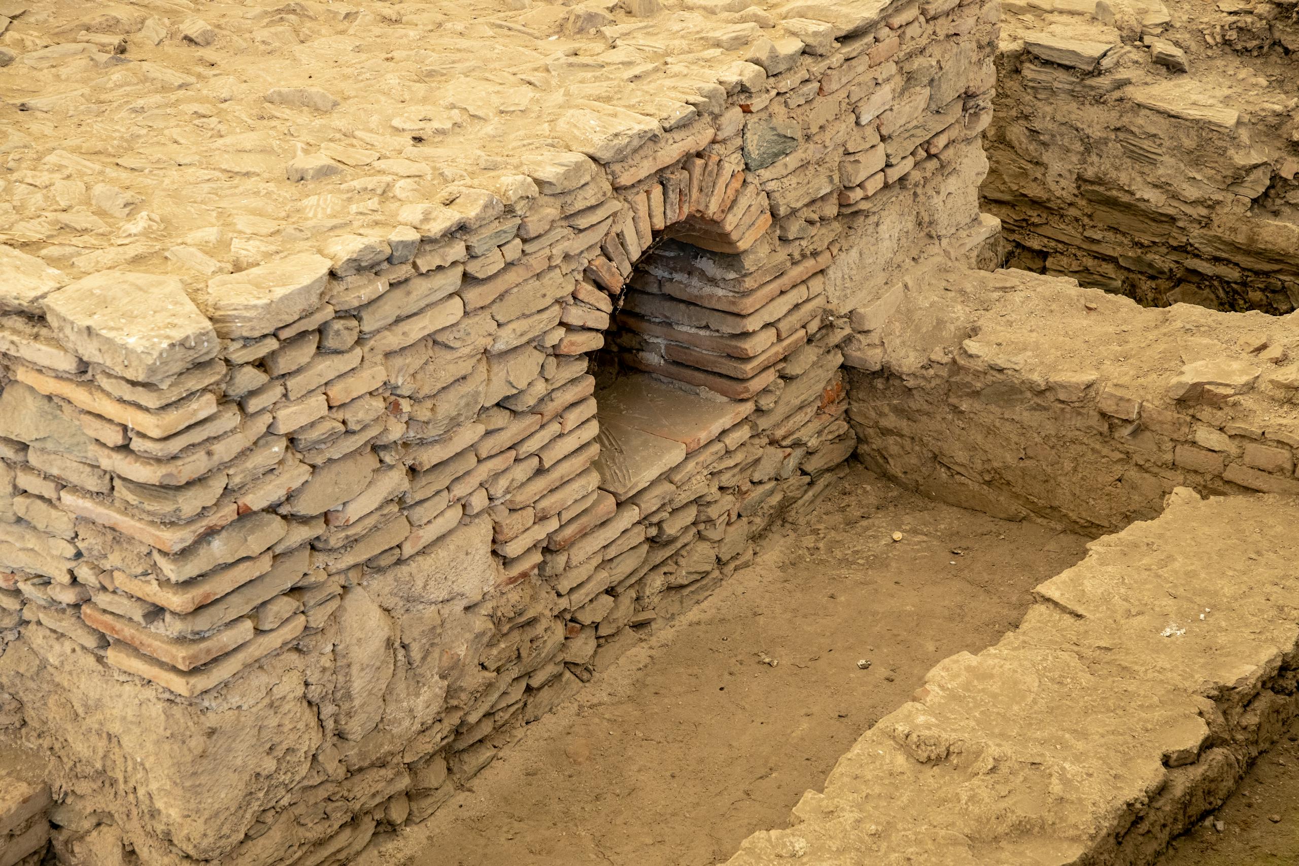 Detailed view of ancient masonry ruins at an archaeological excavation site.